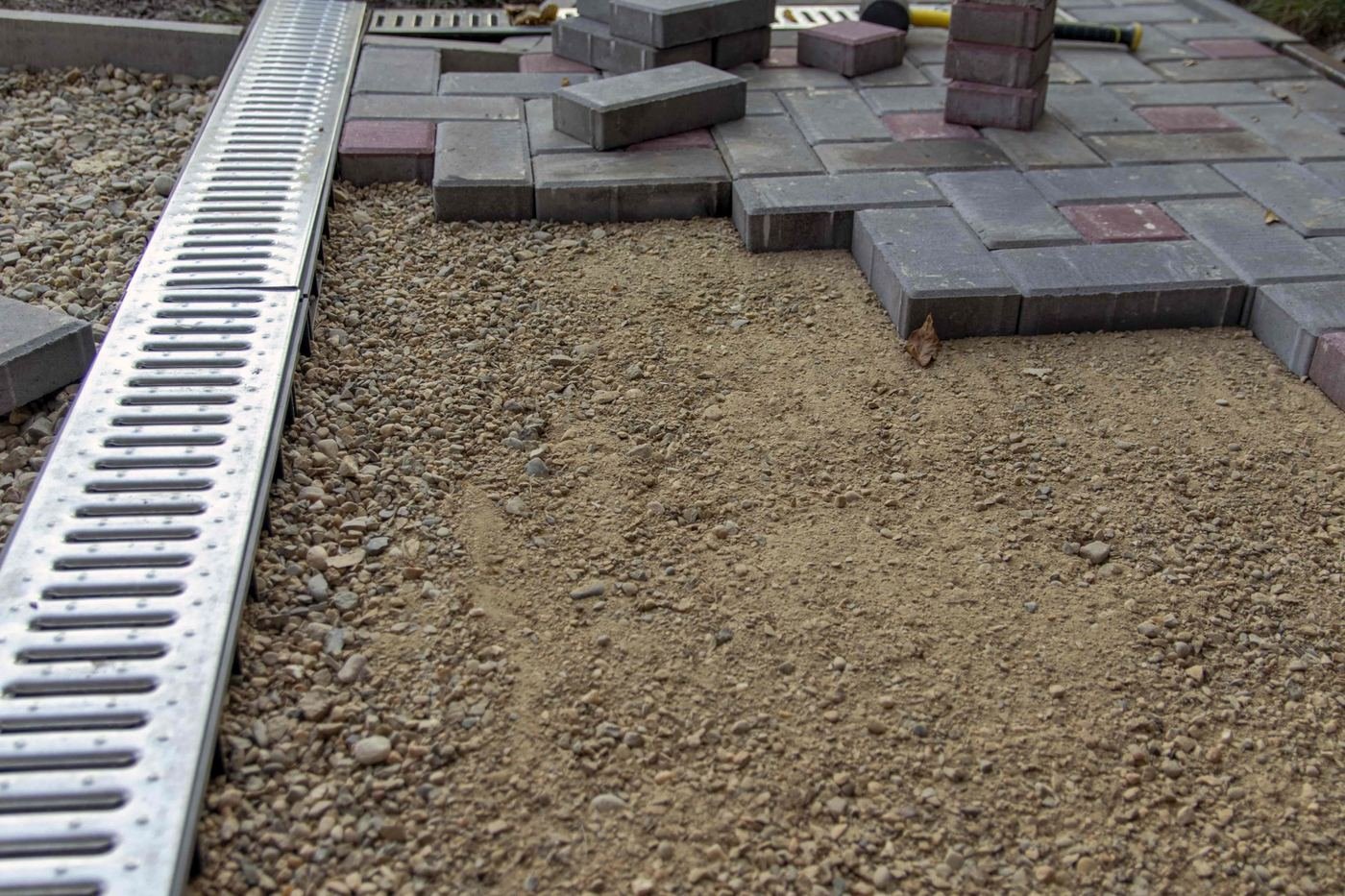Paver drainage channel installation