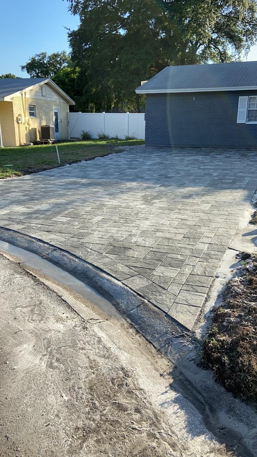 Charcoal paver driveway installation