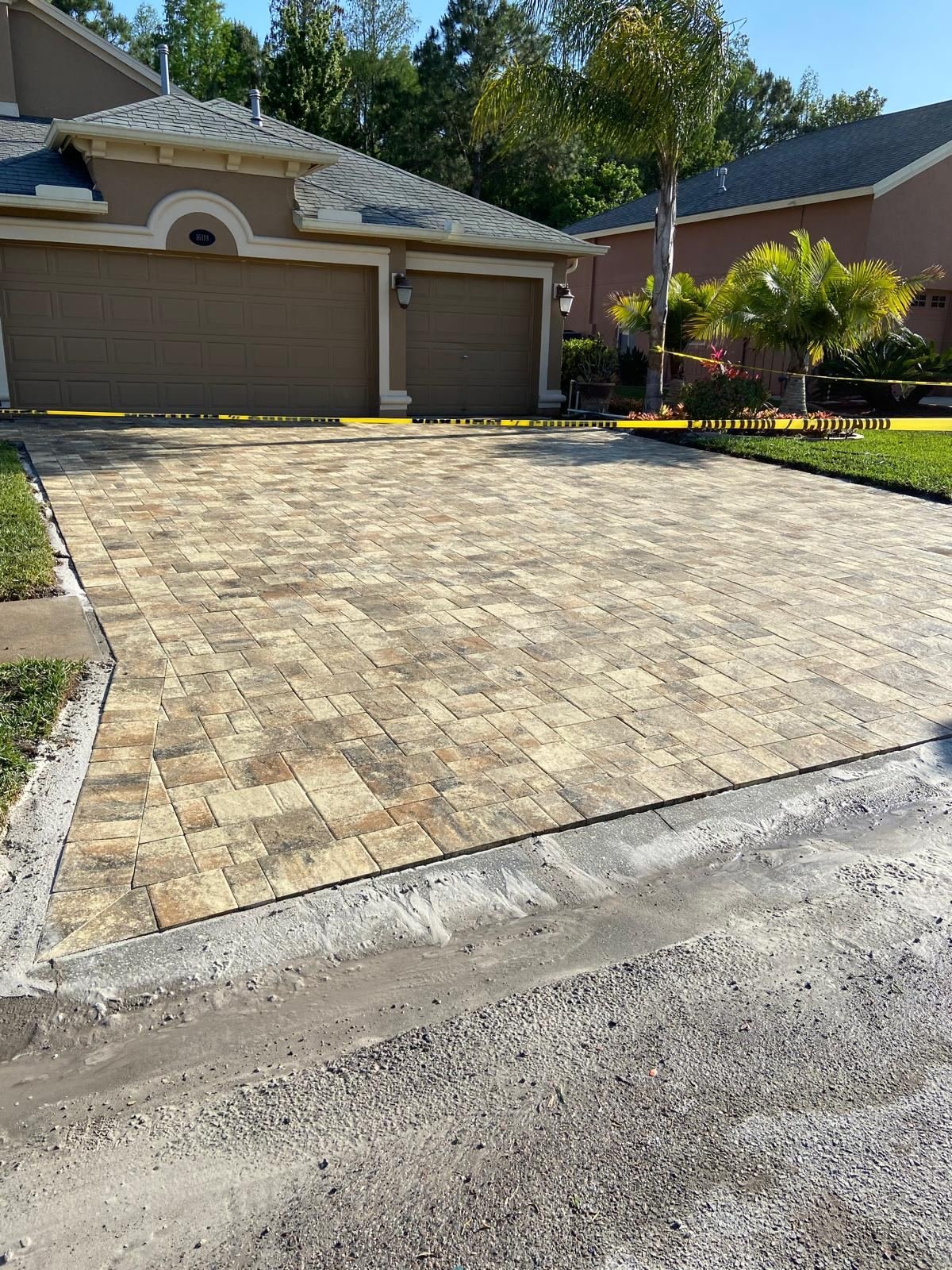 Tan and brown paver driveway installation
