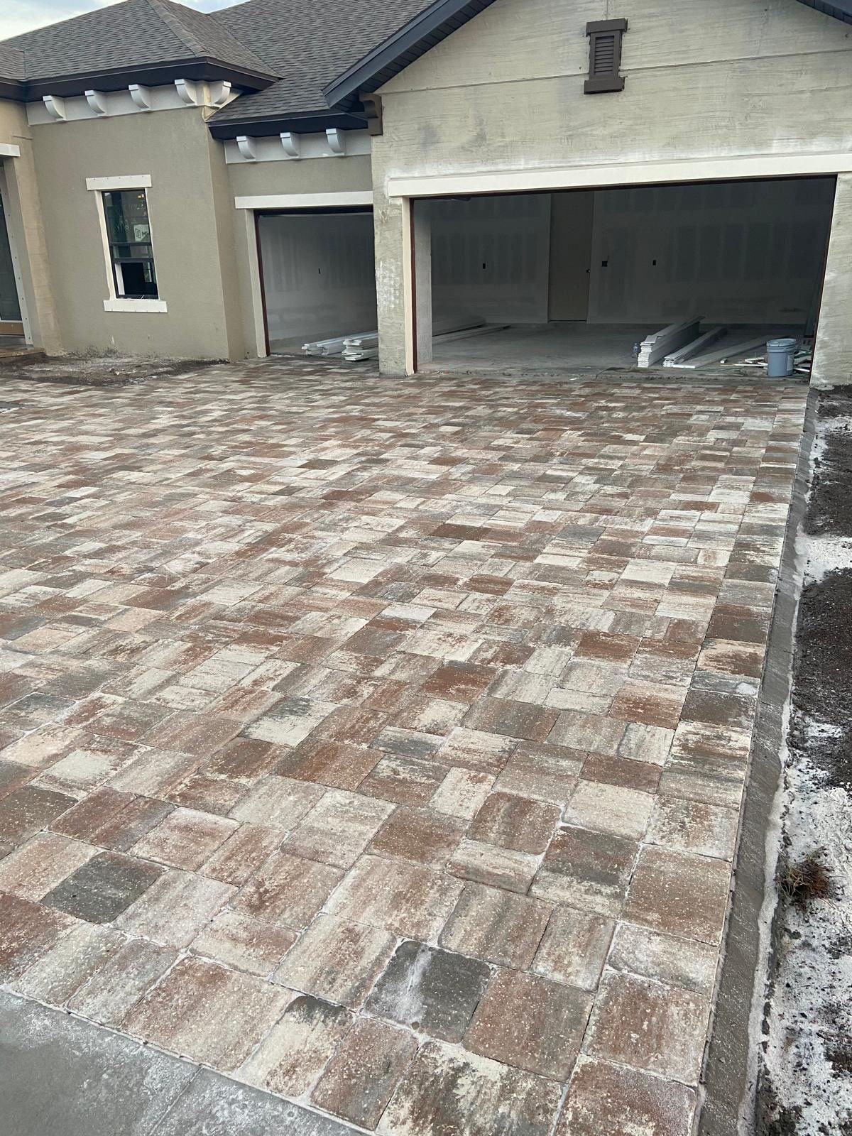 Earth-tone paver driveway installation