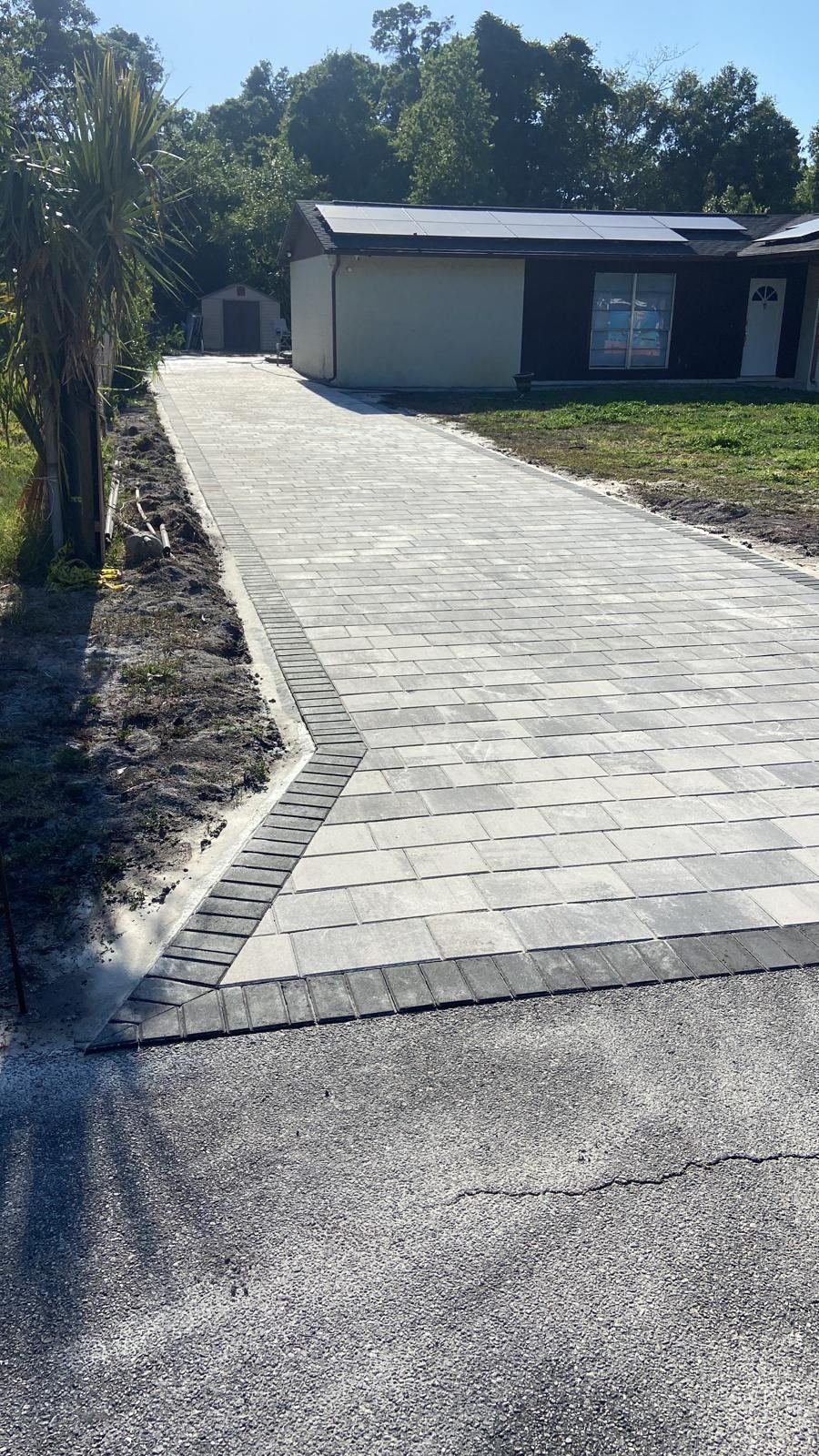 Gray paver driveway with border