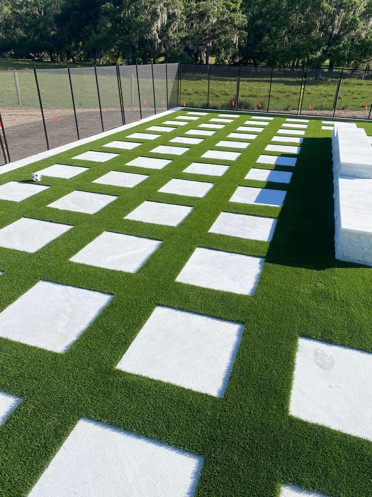 Backyard turf and paver installation after